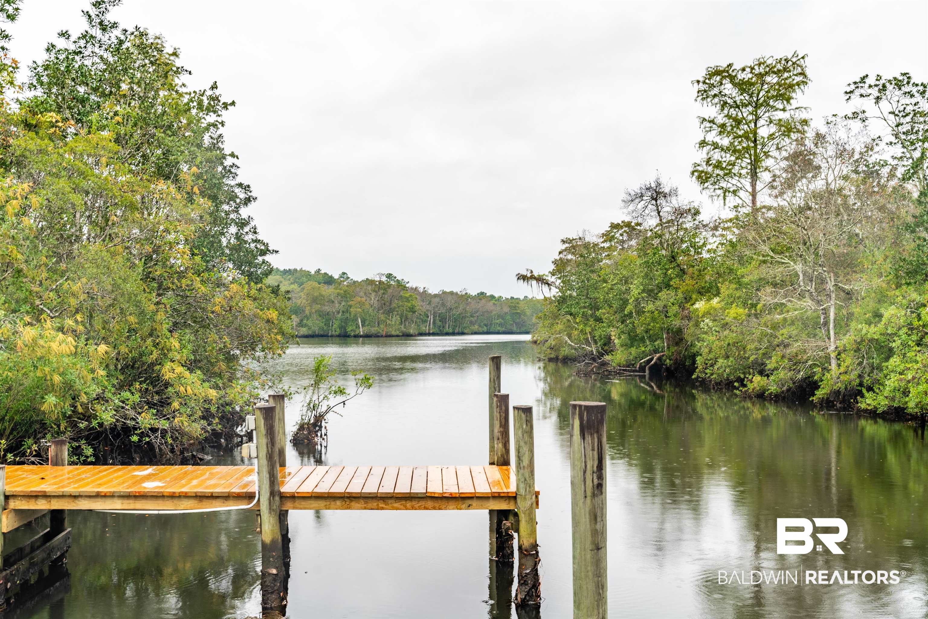 4055 Riviere Du Chien Road Mobile, AL 36693 - Photo 55 of 63 View of dock with a water view