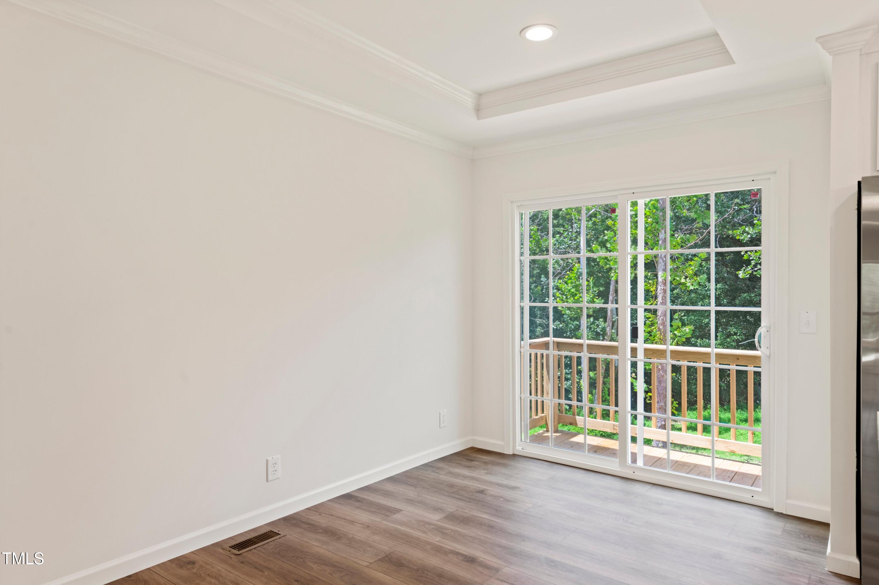 985 John Oakley Road Prospect Hill, NC 27314 - Photo 10 of 23 an empty room with wooden floor and windows
