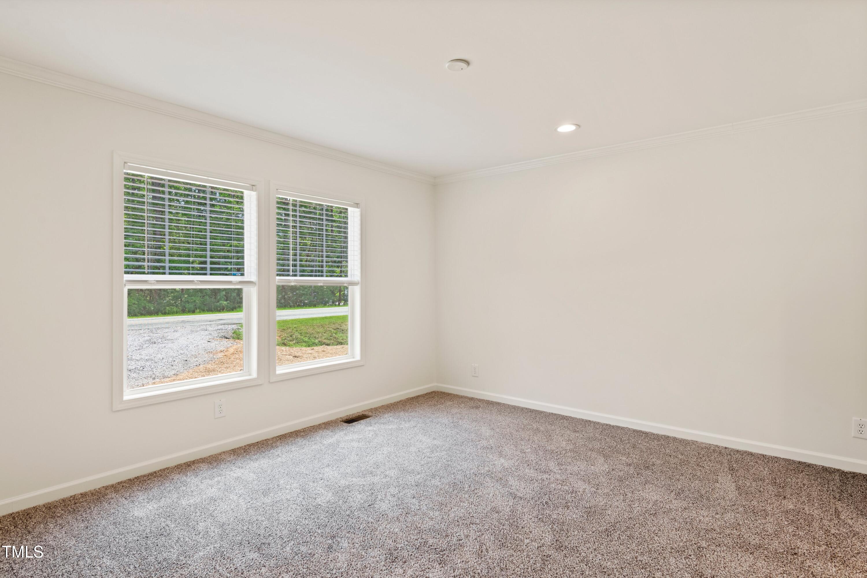 985 John Oakley Road Prospect Hill, NC 27314 - Photo 11 of 23 an empty room with a window