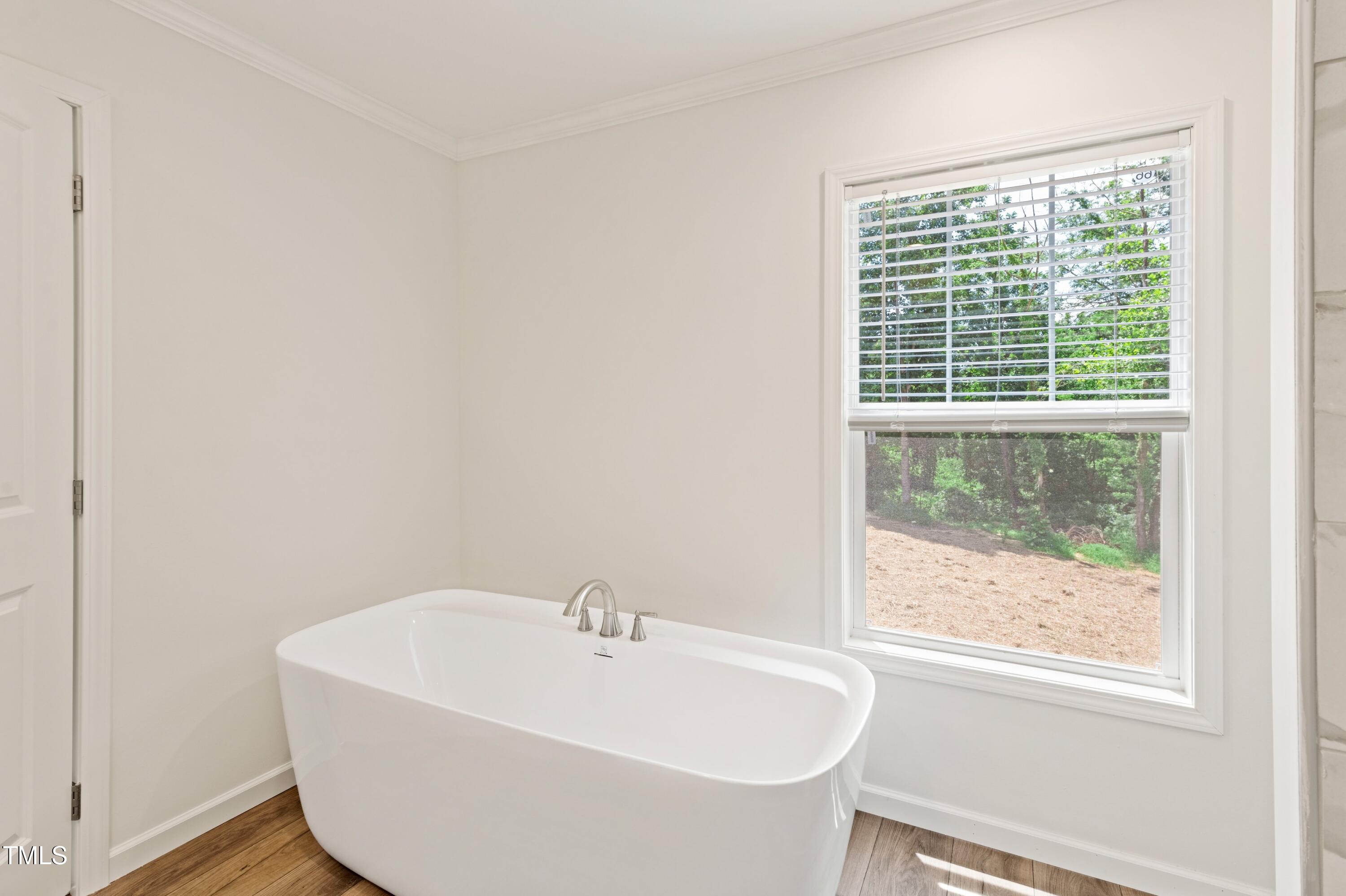 985 John Oakley Road Prospect Hill, NC 27314 - Photo 16 of 23 a white bath tub sitting next to a window