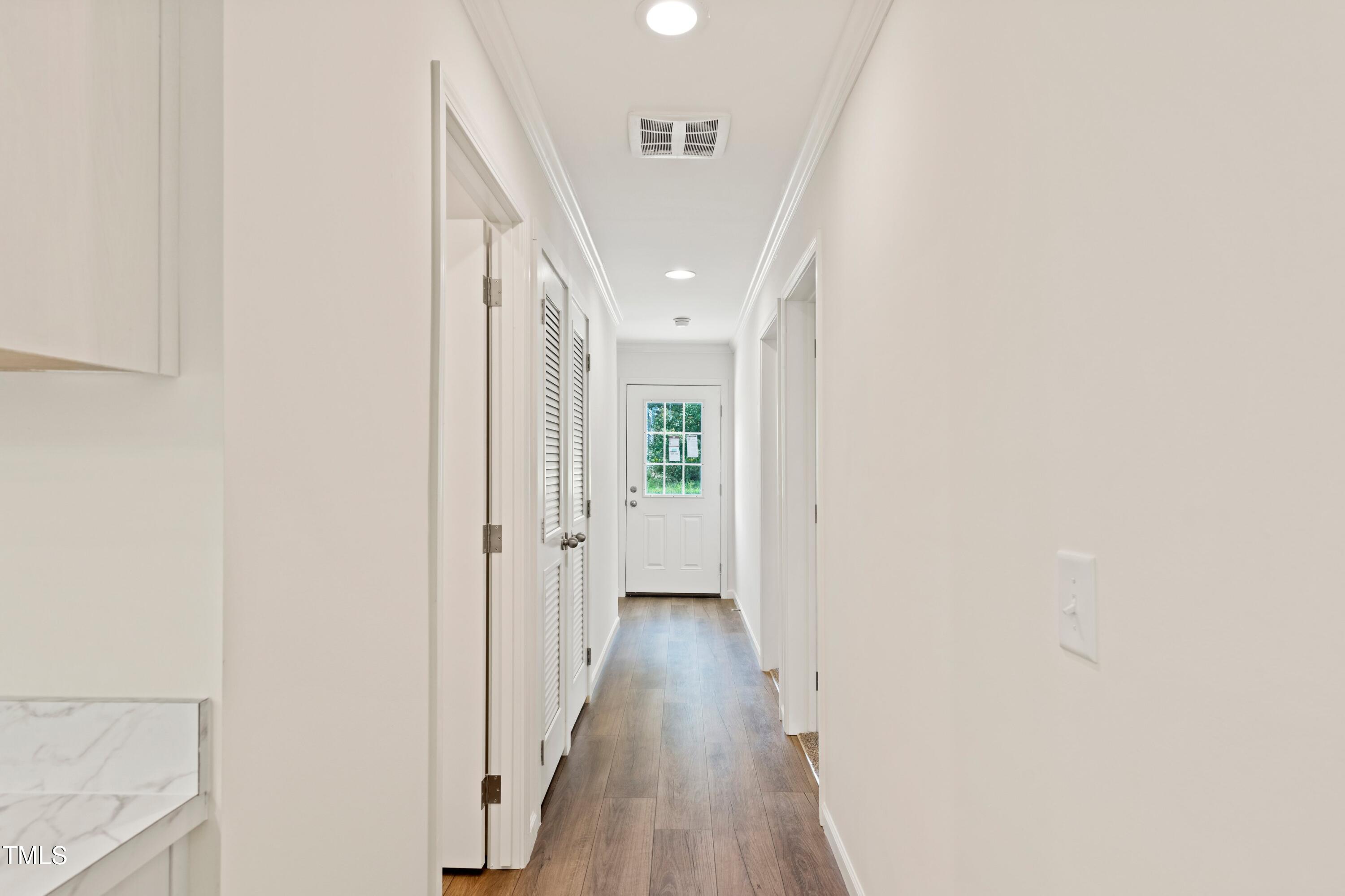 985 John Oakley Road Prospect Hill, NC 27314 - Photo 17 of 23 a view of a hallway with wooden floor and entryway
