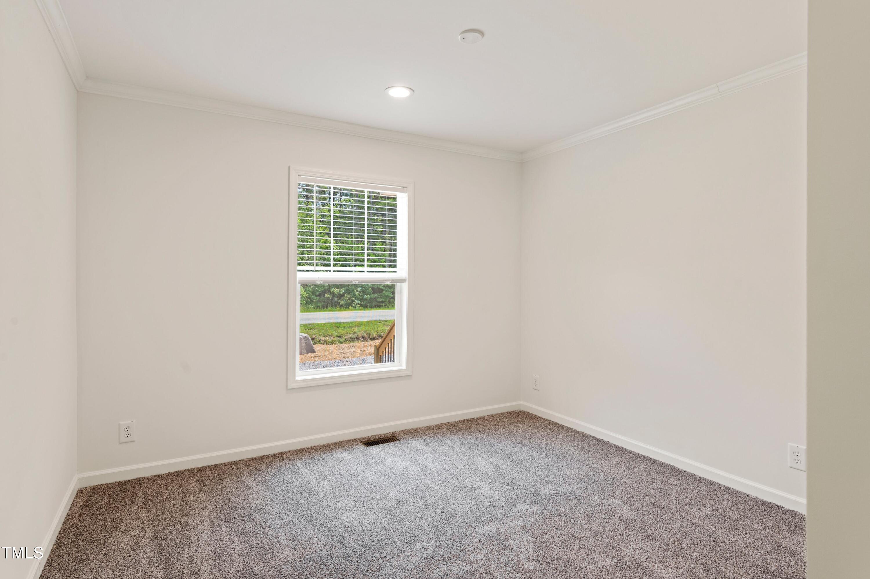 985 John Oakley Road Prospect Hill, NC 27314 - Photo 18 of 23 an empty room with a window