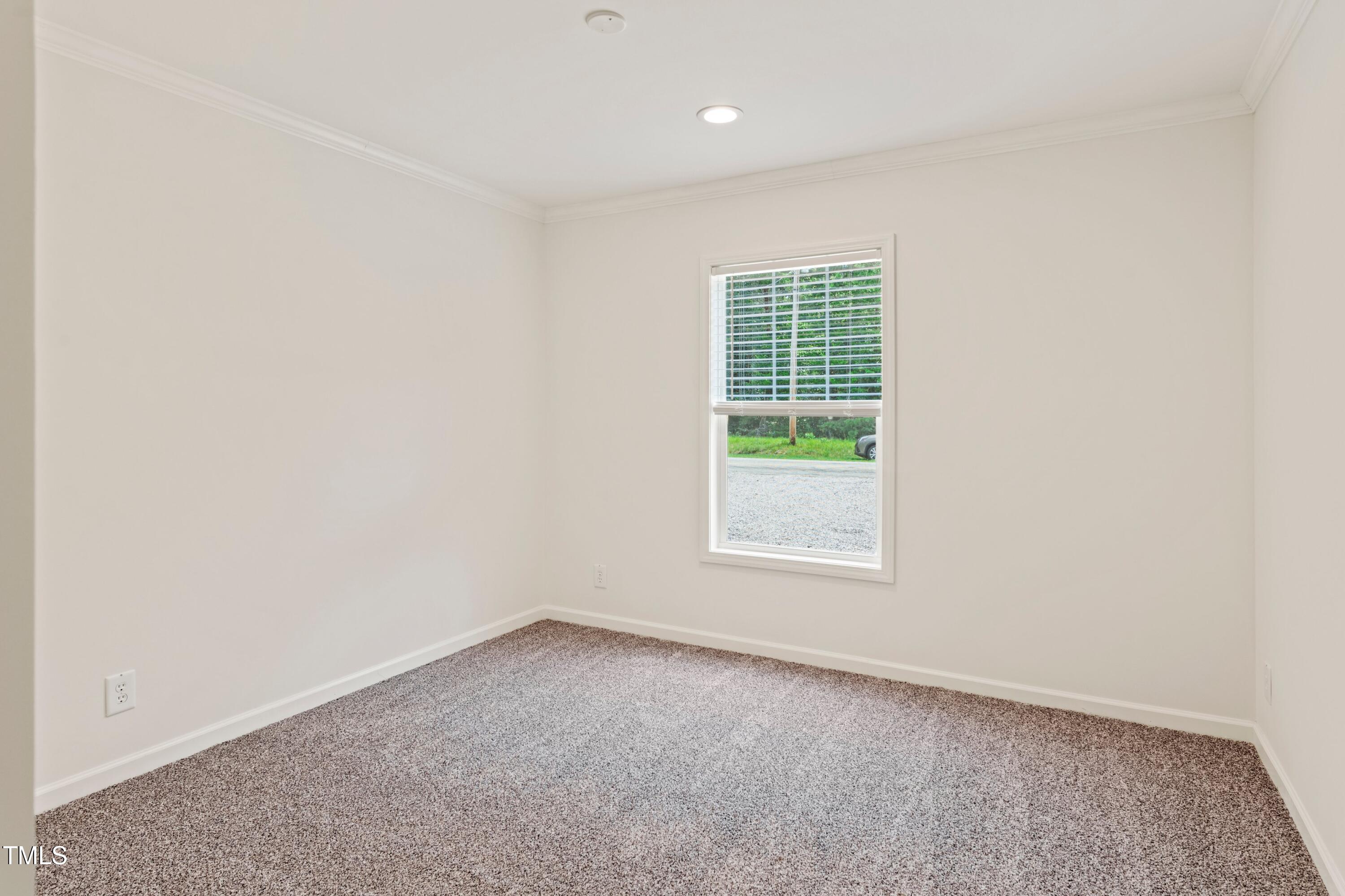 985 John Oakley Road Prospect Hill, NC 27314 - Photo 19 of 23 an empty room with a window