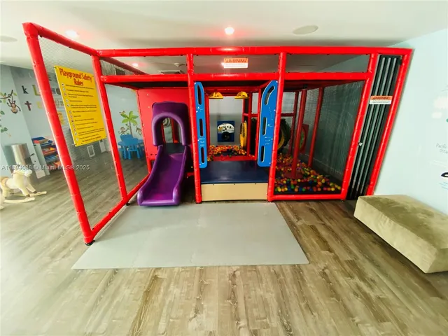 a room with gym equipment and view of living room