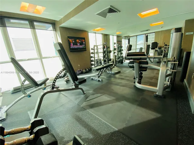 a view of swimming pool with outdoor seating and plants