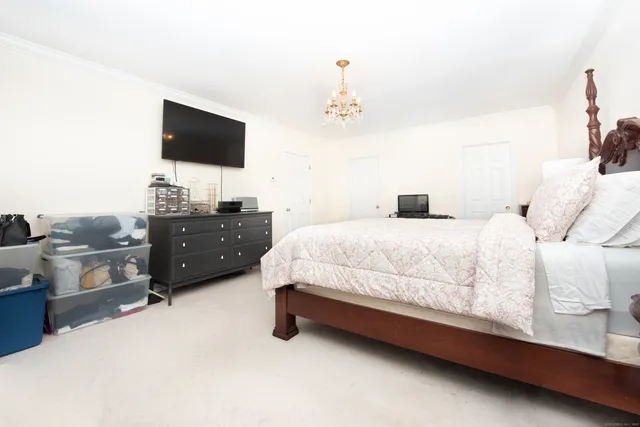 a bathroom with a double vanity sink toilet and a mirror
