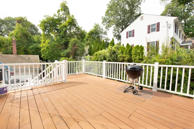 a view of backyard and deck