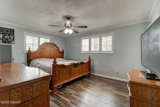 a bedroom with bed and window