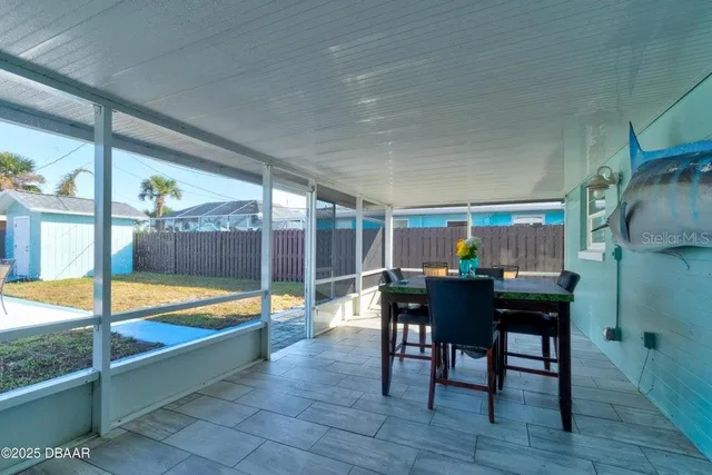 a view of a dining room with furniture window and outside view