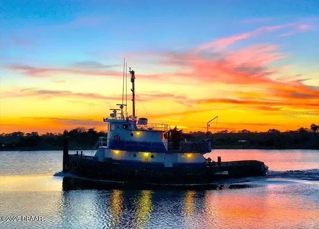 a view of a swimming pool and an outdoor seating