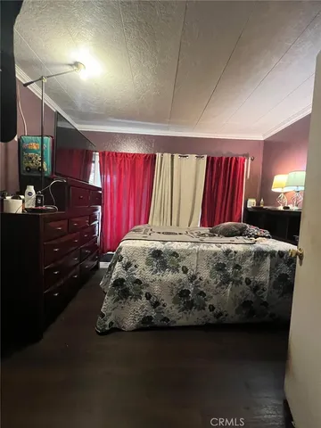 a bed sitting in a room next to a window