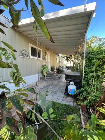 a view of a chairs and table in the patio