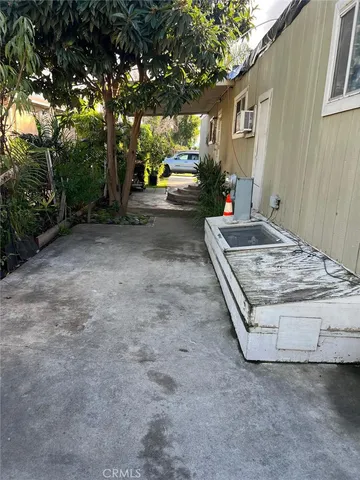 a view of a backyard with sitting area