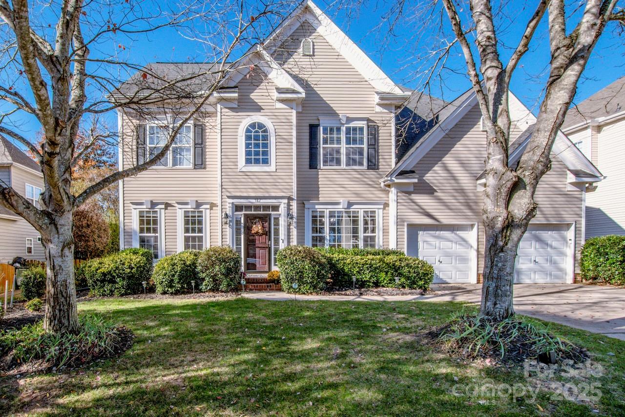 a front view of a house with a garden