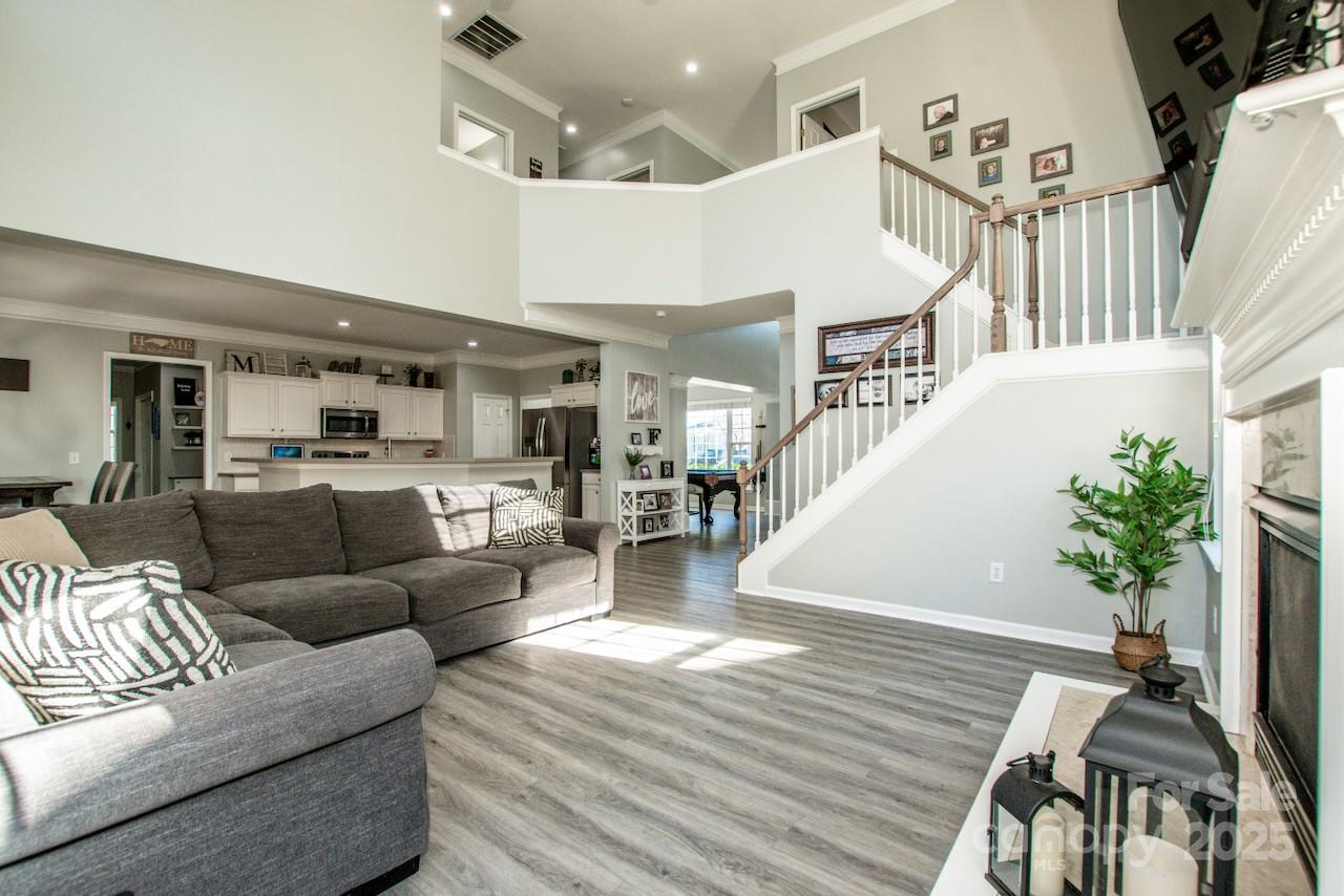 182 Harris Farm Road Mooresville, NC 28115 - Photo 16 of 44 a living room with furniture and wooden floor