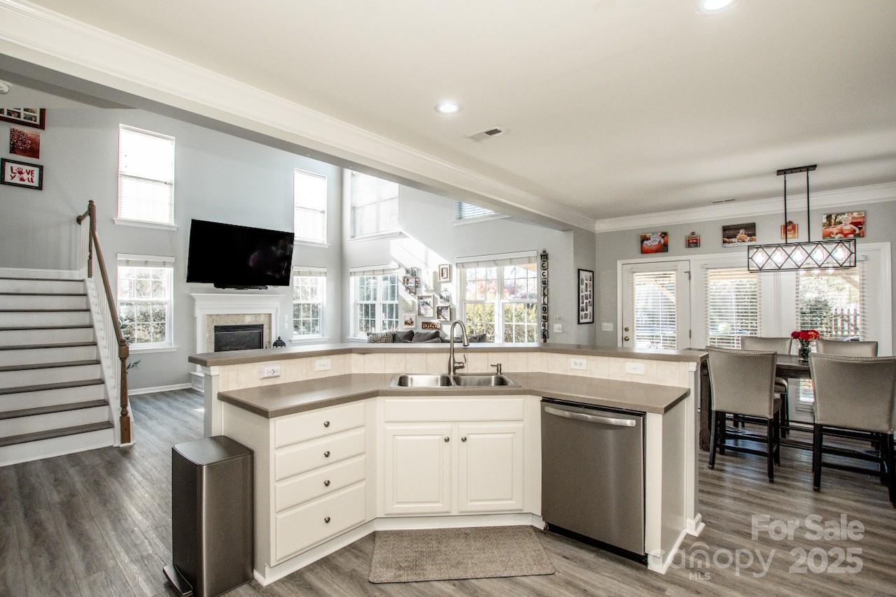 182 Harris Farm Road Mooresville, NC 28115 - Photo 19 of 44 a kitchen with a sink stove and cabinets