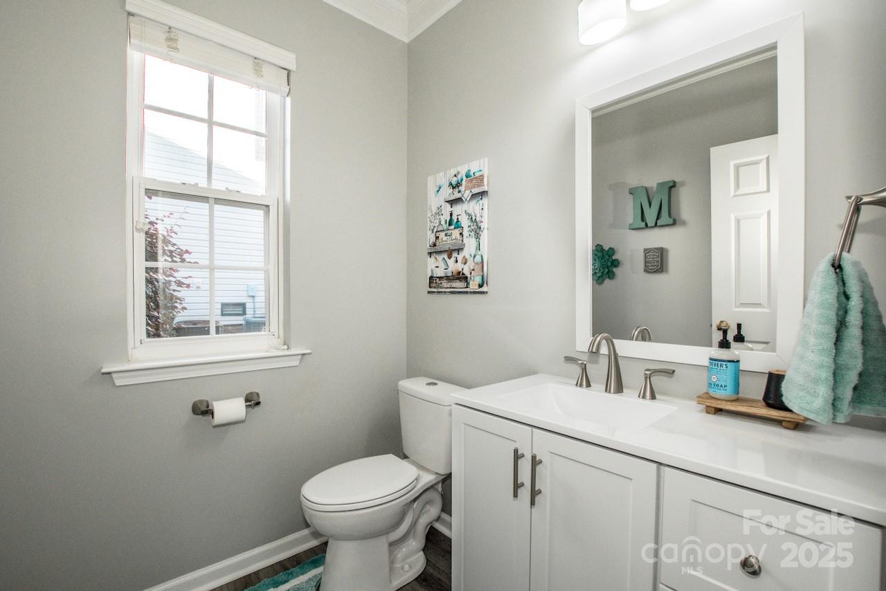 182 Harris Farm Road Mooresville, NC 28115 - Photo 24 of 44 a bathroom with a toilet sink and mirror