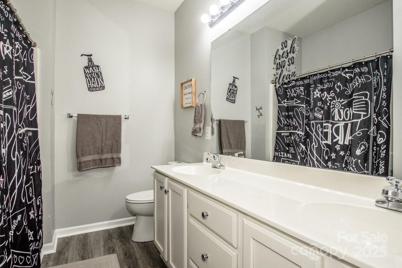 182 Harris Farm Road Mooresville, NC 28115 - Photo 28 of 44 a bathroom with a sink and a mirror