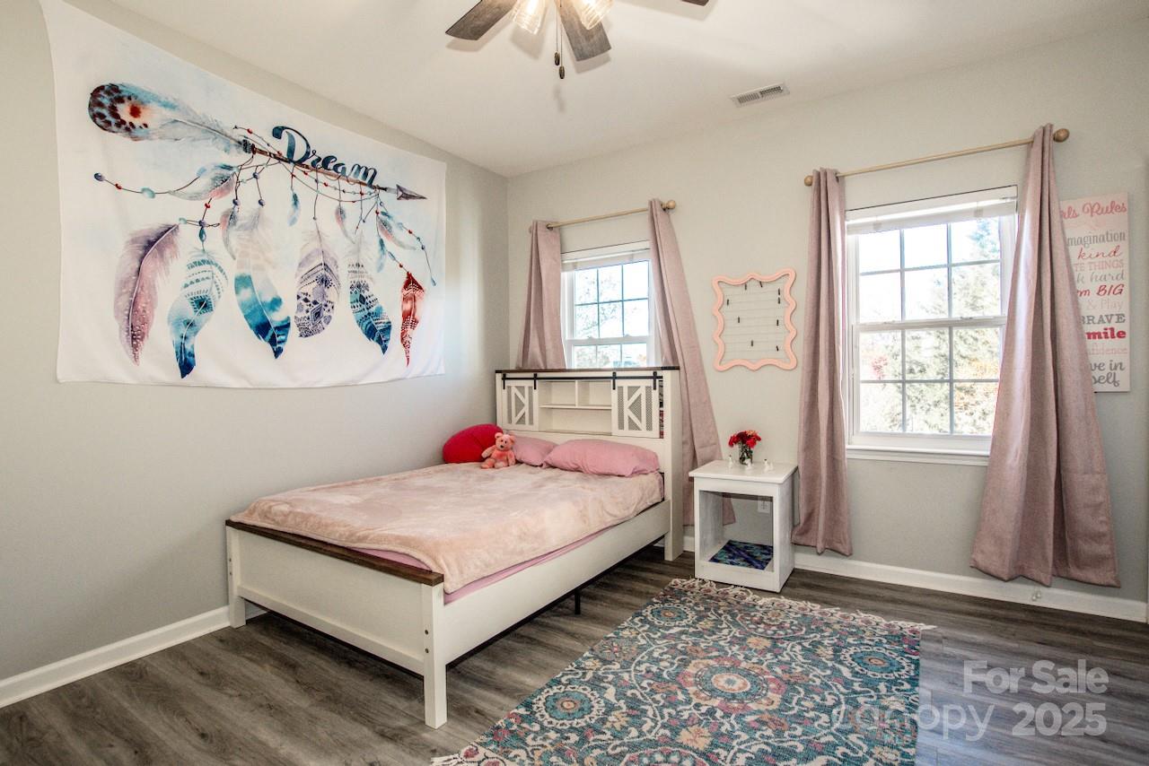 182 Harris Farm Road Mooresville, NC 28115 - Photo 30 of 44 a bedroom with a bed and a window