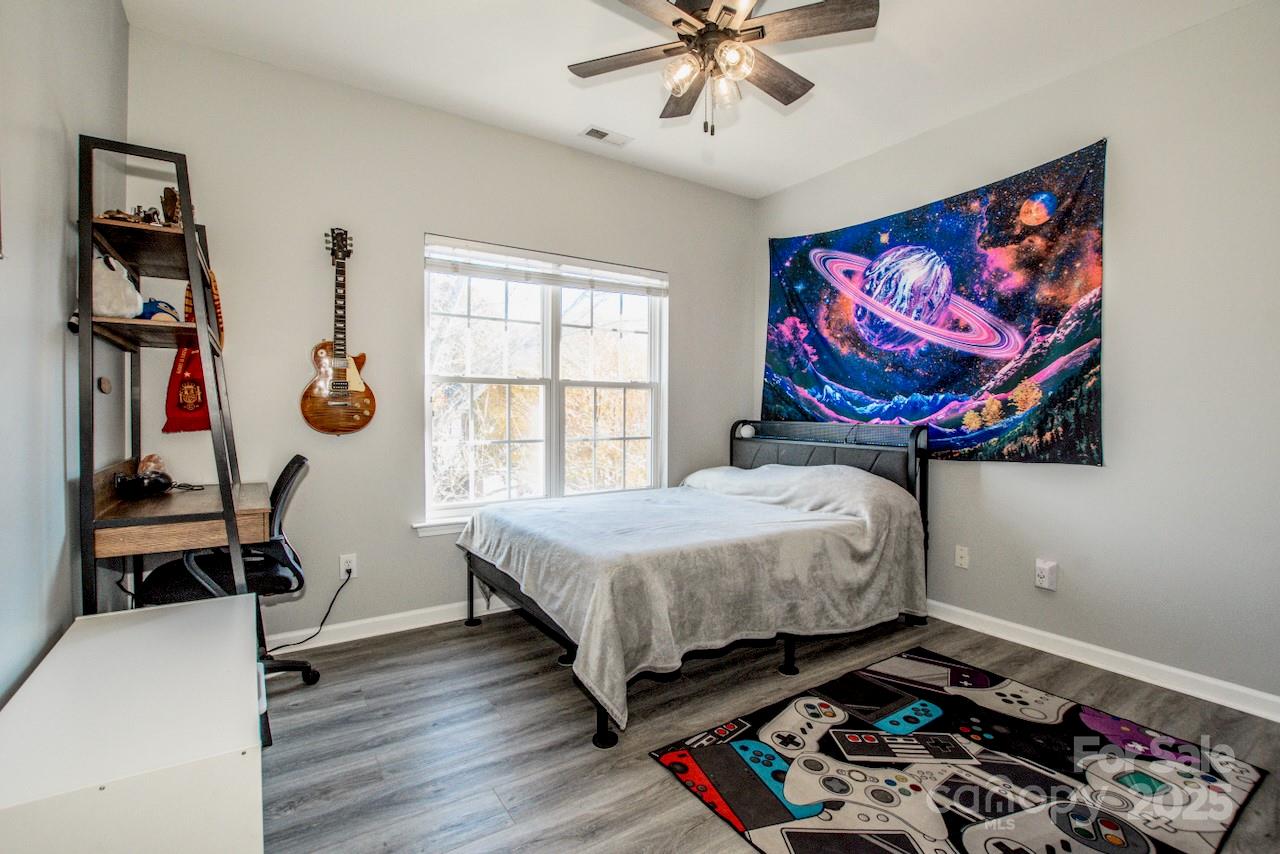 182 Harris Farm Road Mooresville, NC 28115 - Photo 32 of 44 a bedroom with a bed and a window