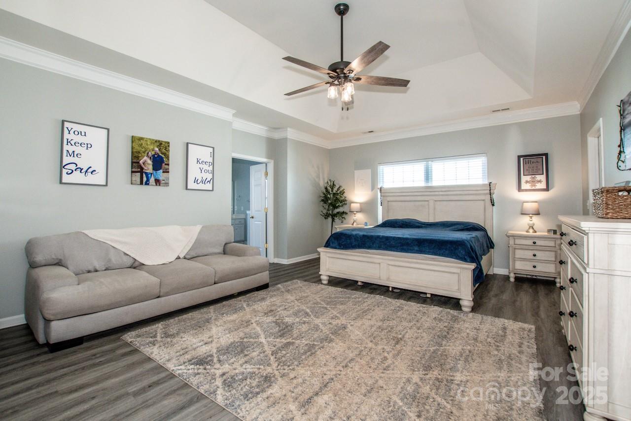 182 Harris Farm Road Mooresville, NC 28115 - Photo 33 of 44 a living room with furniture and a chandelier
