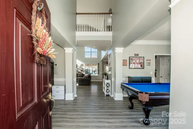 a dinning room with a table and chairs