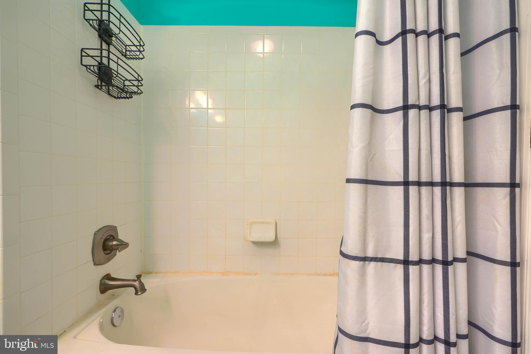 1713 Sea Pine Circle Severn, MD 21144 - Photo 23 of 33 a bathroom with a white bath tub