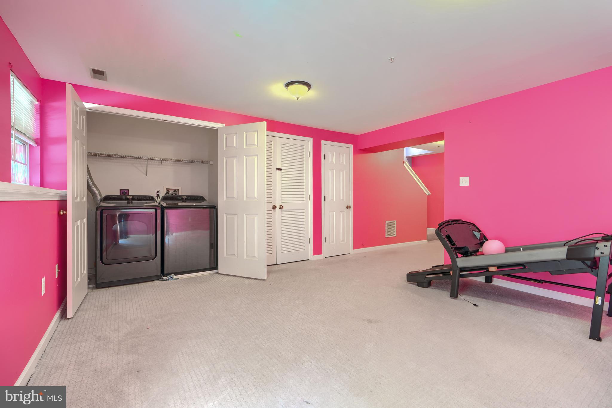 1713 Sea Pine Circle Severn, MD 21144 - Photo 26 of 33 a living room with a table and gym equipment