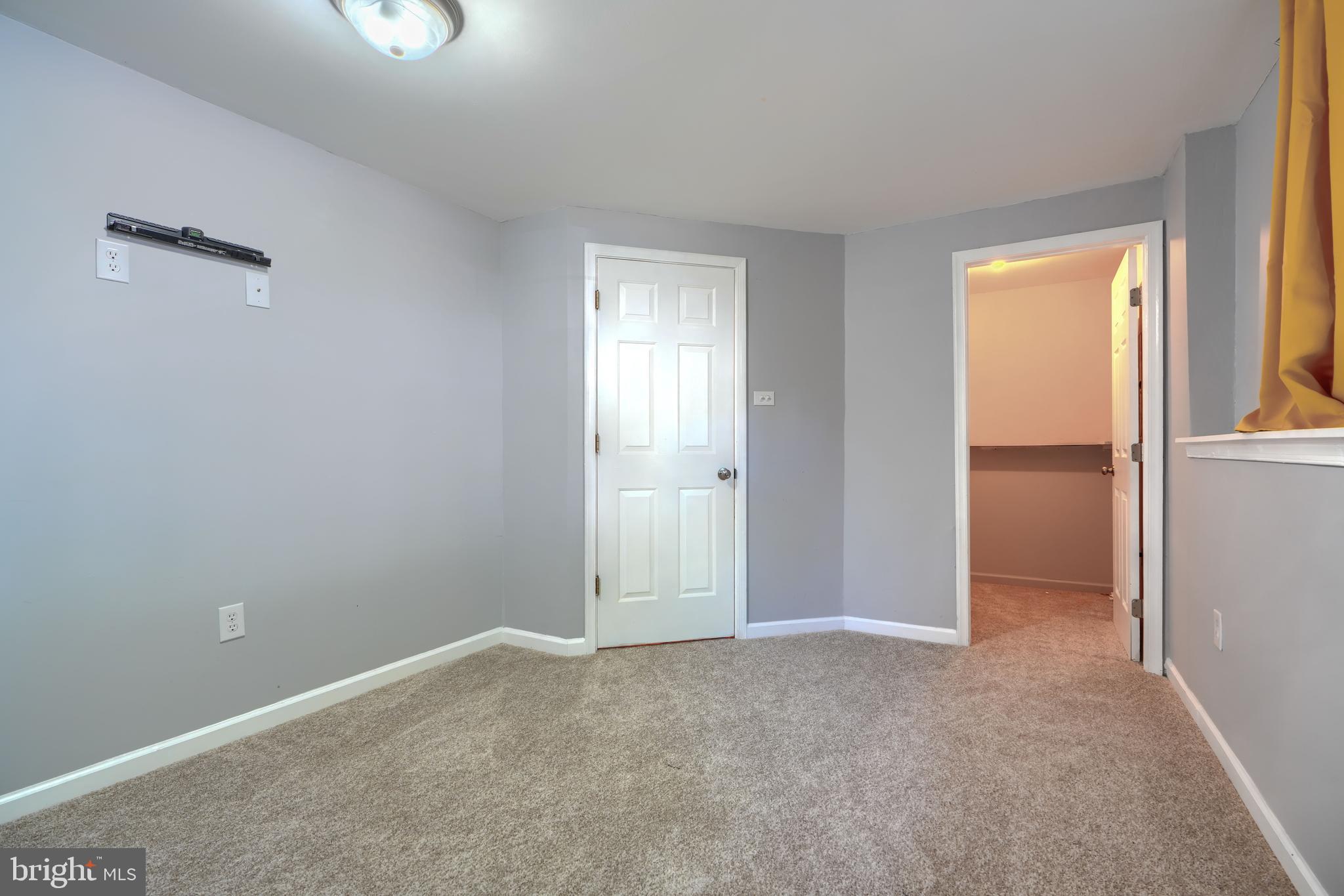 1713 Sea Pine Circle Severn, MD 21144 - Photo 28 of 33 a view of an empty room with closet and a window