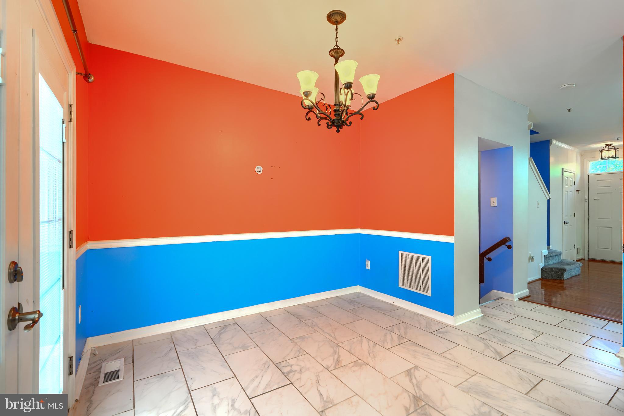 1713 Sea Pine Circle Severn, MD 21144 - Photo 8 of 33 a view of a room with a chandelier and wooden floor