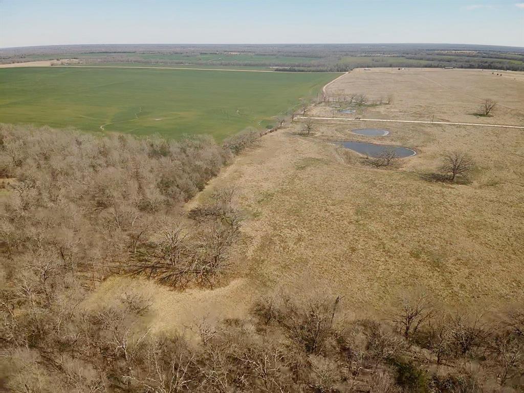 Lot 7 Ranches At Quail Hollow Paris, TX 75462 - Photo 8 of 11 Birds eye view of property with a rural view