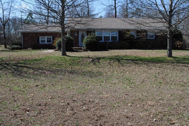 1357 A Academy Road Portland, TN 37148 - Photo 1 of 19 a front view of a house with a yard
