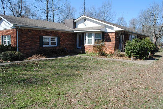 1357 A Academy Road Portland, TN 37148 - Photo 4 of 19 a front view of a house with a yard