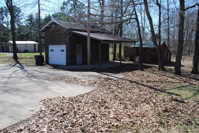 1357 A Academy Road Portland, TN 37148 - Photo 5 of 19 a front view of a house with a yard covered with snow