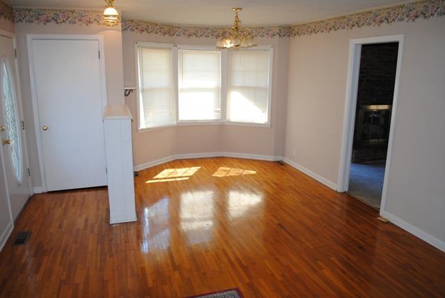 1357 A Academy Road Portland, TN 37148 - Photo 6 of 19 wooden floor in an empty room with a window