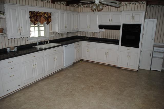 1357 A Academy Road Portland, TN 37148 - Photo 9 of 19 a kitchen with a sink and cabinets