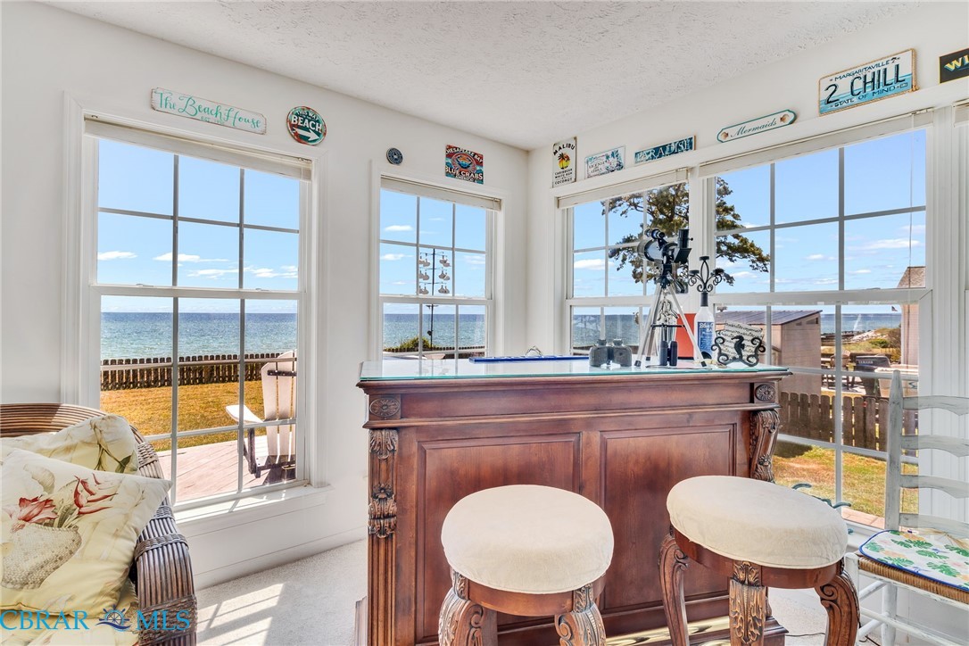 13 Leming Avenue Reedville, VA 22539 - Photo 20 of 50 Interior space featuring multiple large windows offering expansive ocean views