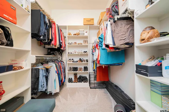 a bedroom with bed and a couch