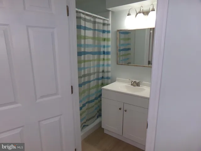 a bathroom with a sink a toilet and vanity