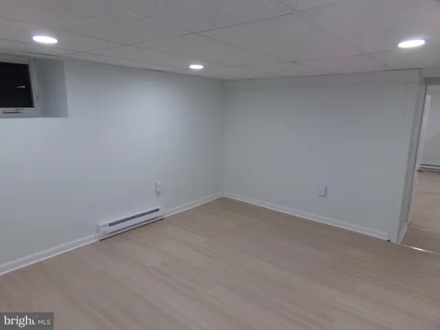 a view of hallway with wooden floor