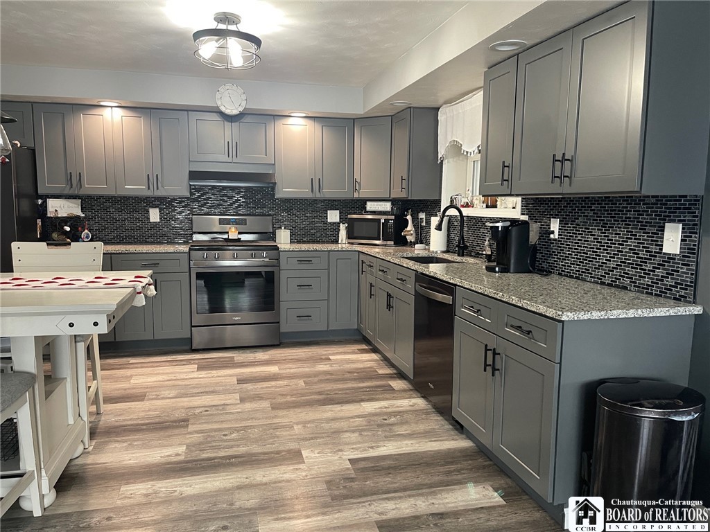 3833 Sherman Ripley Road Sherman, NY 14781 - Photo 13 of 48 Kitchen with stainless steel appliances, double si