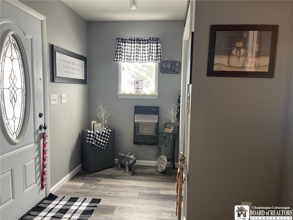 3833 Sherman Ripley Road Sherman, NY 14781 - Photo 8 of 48 Entry room with wall hung gas heater and coat clos