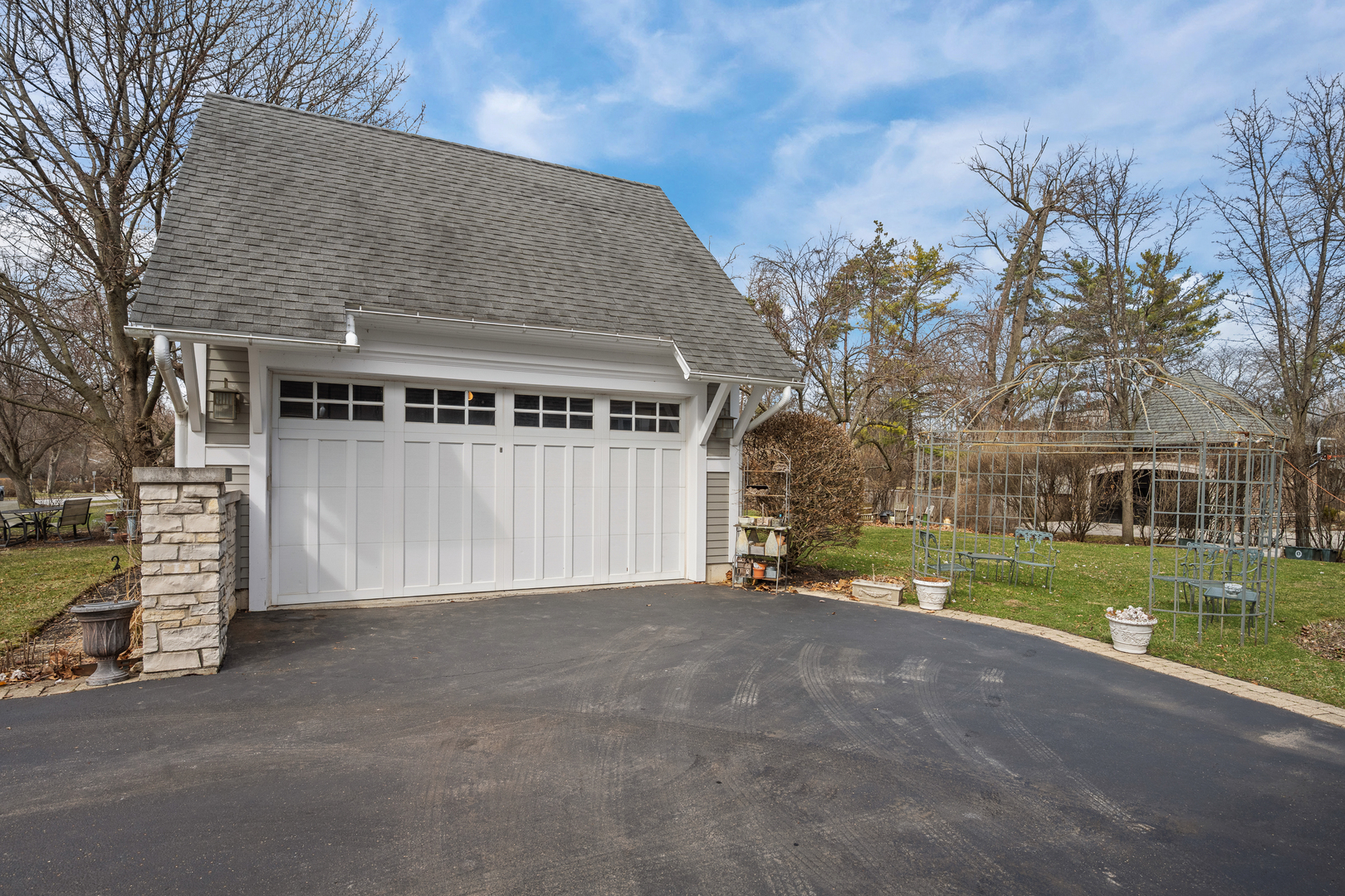 780 Prairie Road Glencoe, IL 60022 - Photo 27 of 30 a view of a house with a yard and garage
