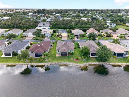an aerial view of a houses with a street