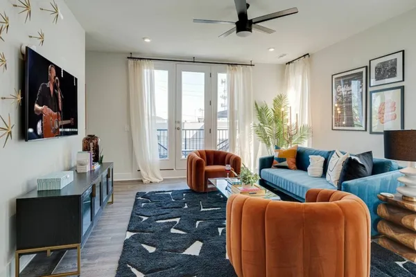 a living room with furniture and a flat screen tv