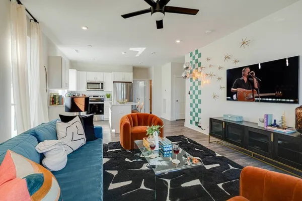 a living room with furniture and a flat screen tv