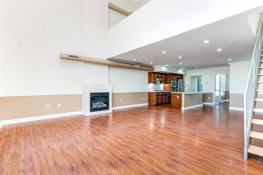 596 South Brea Boulevard Brea, CA 92821 - Photo 5 of 33 a view of a livingroom with wooden floor and a fireplace