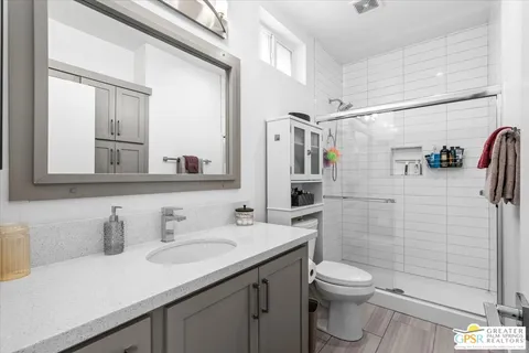 a bedroom with a bed and hallway