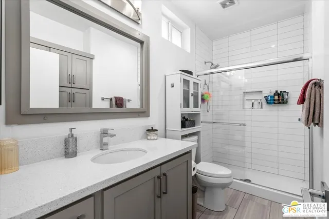 a bedroom with a bed and hallway