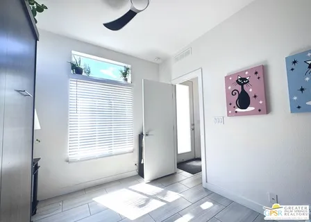 a view of a hallway with washer and dryer